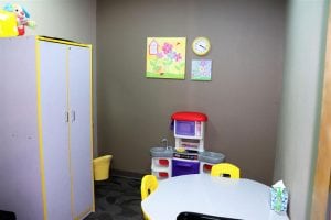 Bright and colorful flower-themed therapy room at New Beginnings.